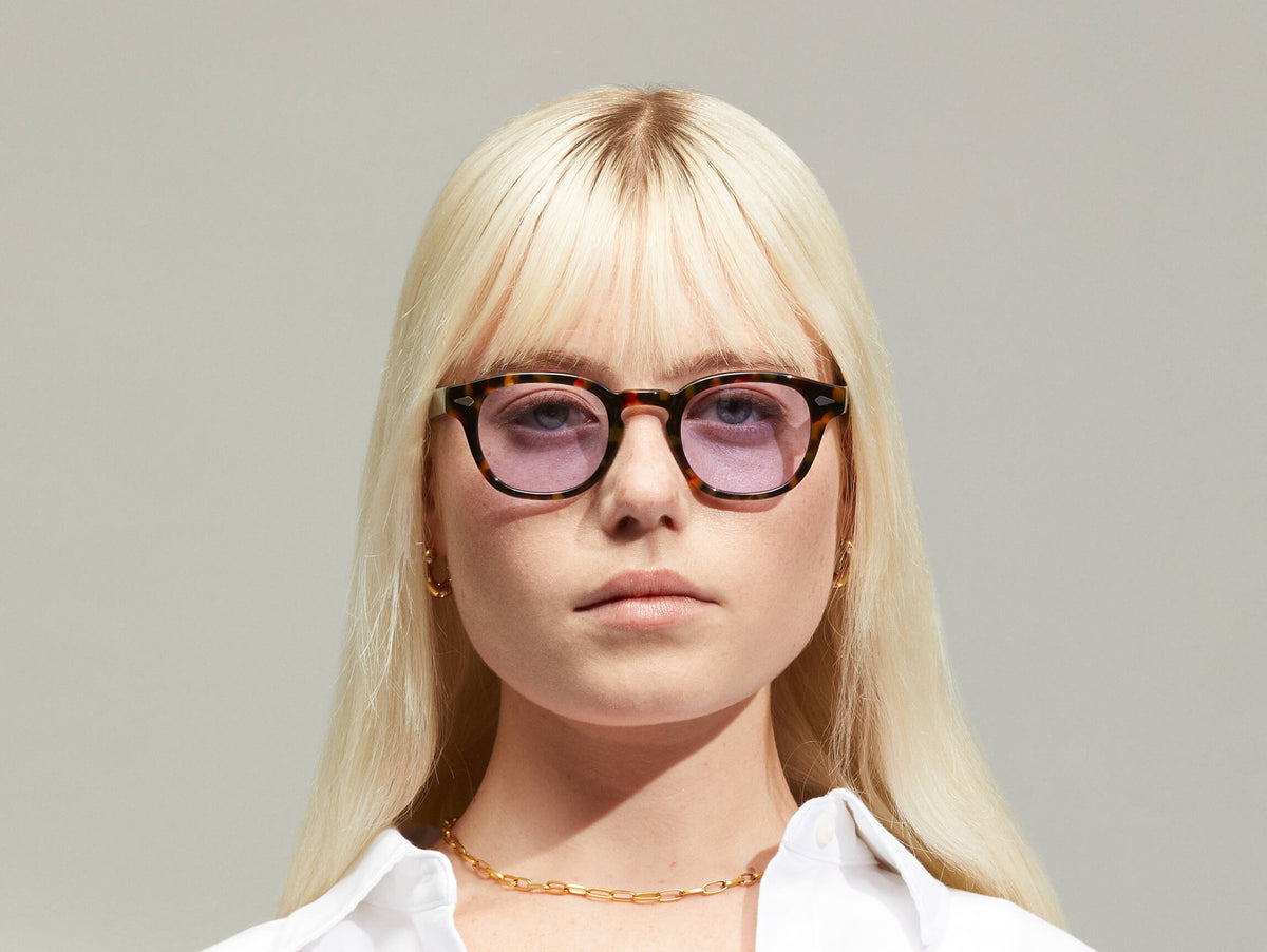 Model is wearing The LEMTOSH in Tortoise in size 46 with Lavender Tinted Lenses
