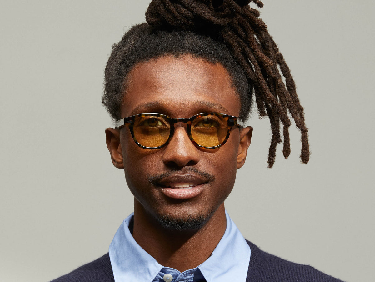 Model is wearing The LEMTOSH in Tortoise in size 46 with Pastel Yellow Tinted Lenses