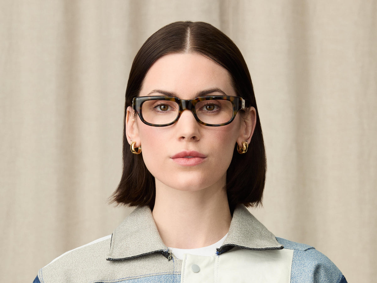 Model in wearing The SHTUP in size 51 in Tortoise