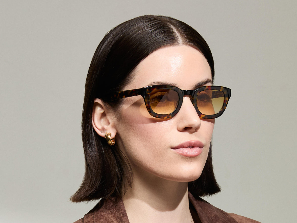 Model is wearing The TELENA  in Tortoise/Black in size 44 with Chestnut Fade Tinted Lenses