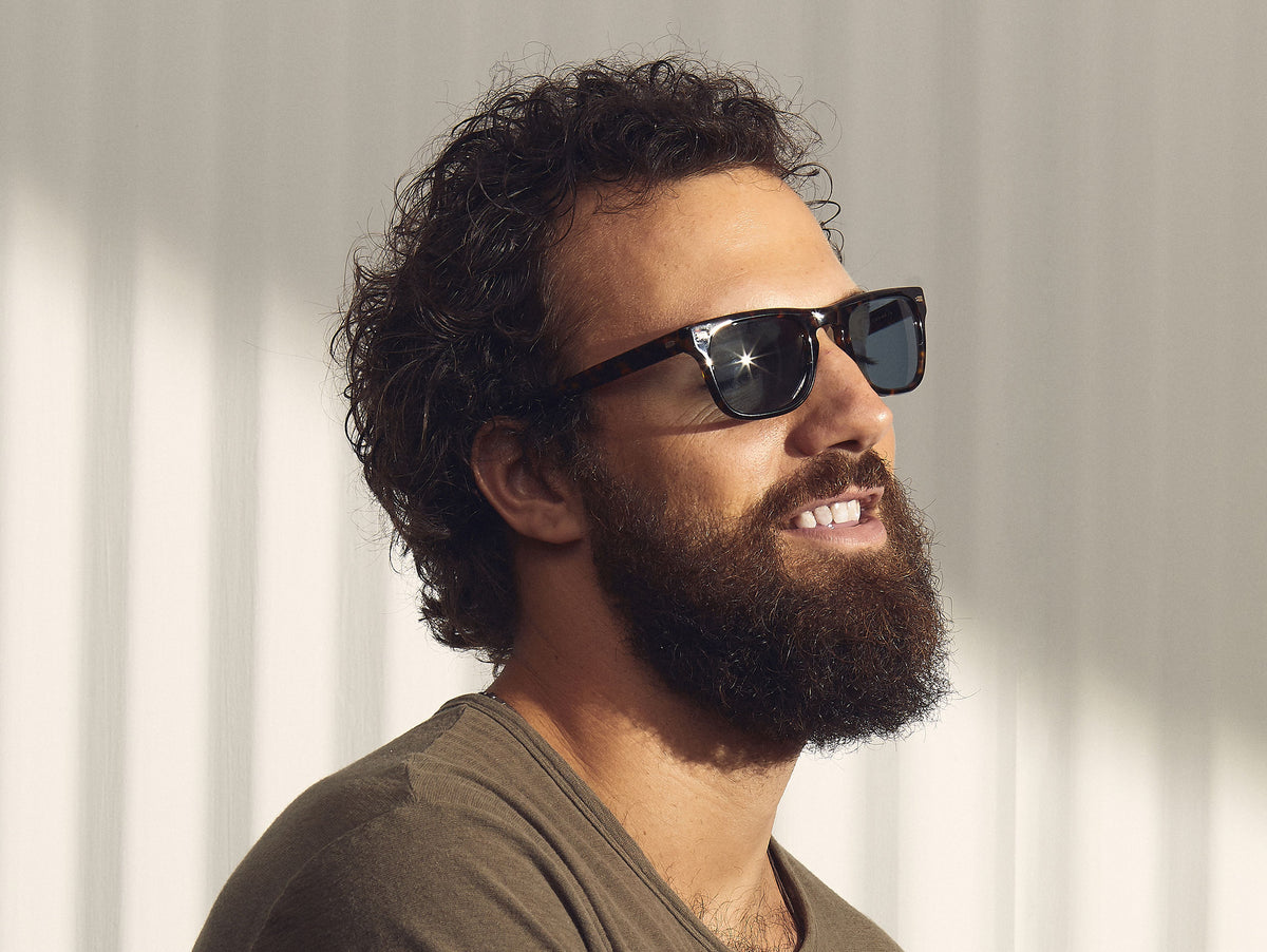 Model is wearing The KAVELL SUN in Tortoise in size 51 with Blue Glass Lenses
