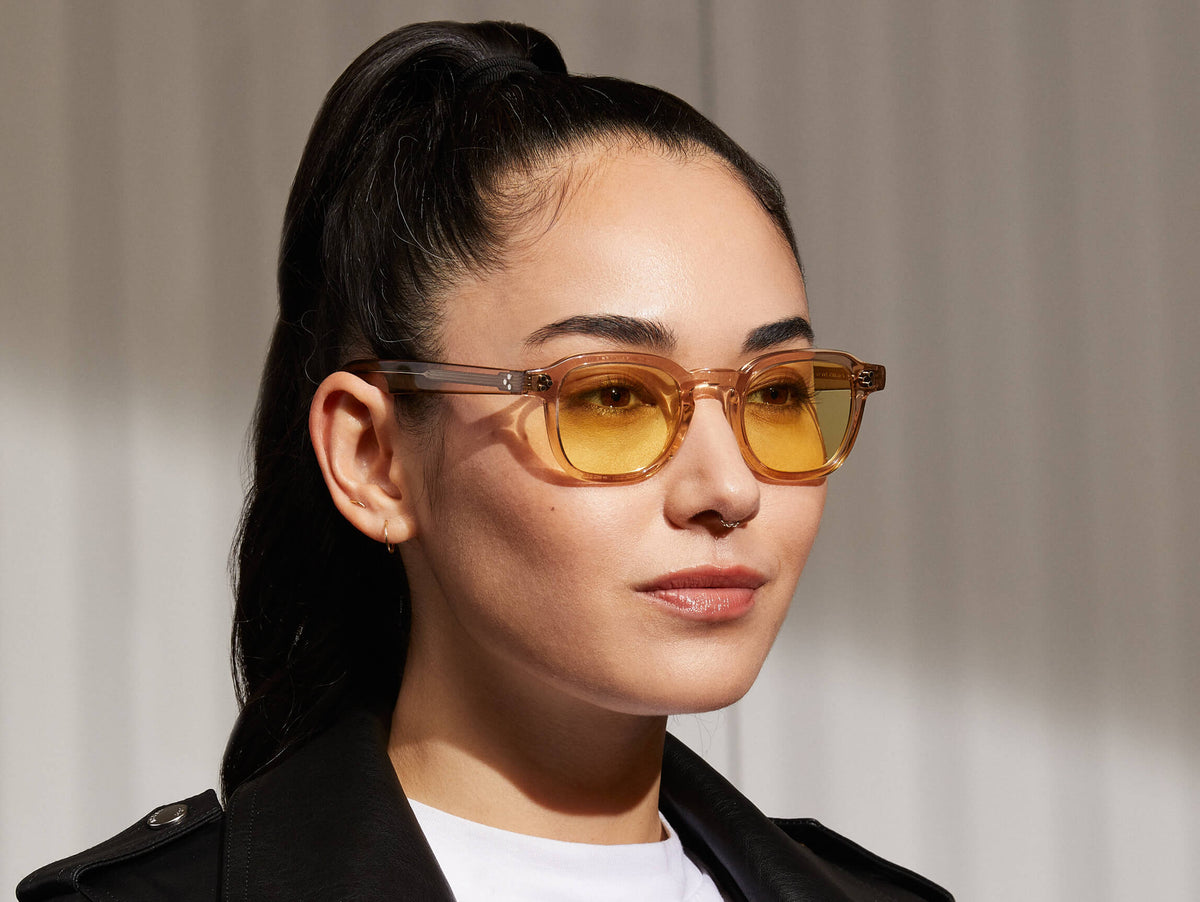 Model is wearing The MOMZA in Cinnamon in size 46 with Pastel Yellow Tinted Lenses